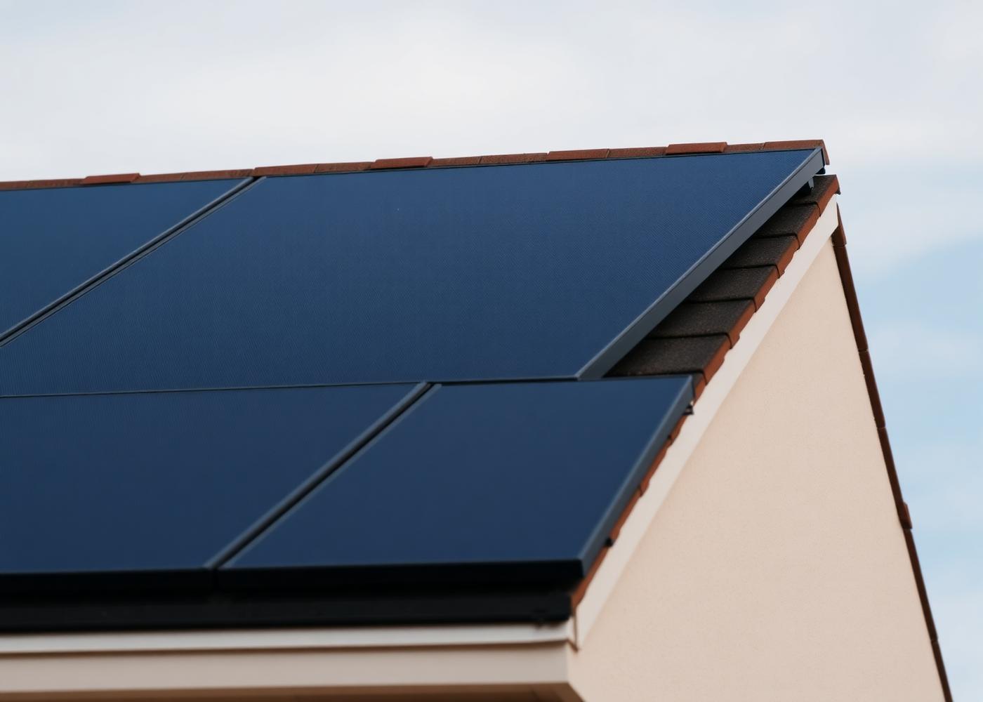 Close-up of modern all-black solar panels fitted to a North West pitched roof